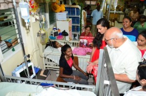 President Donald Ramotar chatting with a patient in the Paediatric Ward of the GPHC