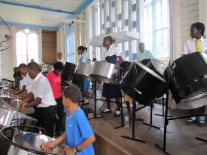 Panwave band members practising various songs on the steel pan