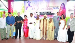 Acting Tourism Minister Irfaan Ali (second left); Public Relations Consultant Kit Nascimento (left); and Roraima Group of Companies Chairman, Captain Gerry Gouveia with selected couples at the launch of the sixth Wedding Expo on Friday at Duke Lodge, Duke Street, Georgetown (Carl Croker photo) 