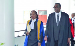 Caribbean Court of Justice outgoing judge, Justice Desiree Bernard and Belizean Chief Justice Kenneth Benjamin heading into the special sitting of the court on Wednesday to honour her contributions to both the local and regional legal fraternity (Carl Croker photo)      