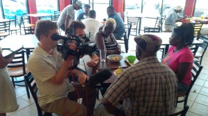 BBC crew (left) interviewing persons in the restaurant