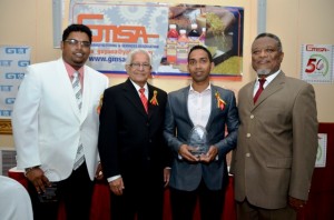 Acting Tourism Minister Irfaan Ali, former TT Prime Minister Basdeo Panday, NEW GPC INC Marketing Manager Trevor Bassoo and Prime Minister Samuel Hinds at the awards ceremony