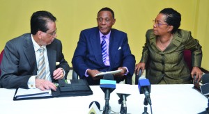 The Commissioners of the Walter Rodney Commission chat after the press briefing