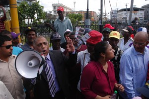 Agriculture Minister, Dr Leslie Ramsammy addressing those gathered outside of the National Assembly to lobby for parliamentary approval of the Gy$6B subvention budgeted for the sugar industry