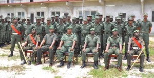 Army Chief-of-Staff, Brigadier Mark Phillips and Commanding Officer Training Corps, Lieutenant Colonel Terry Benn with a platoon of recruits and training staff at Tacama