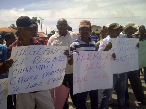 Scores of farmers protesting against poor drainage and non-payments for paddy supplied to millers