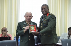 GDF Chief-of-Staff, Brigadier Mark Phillips handing over a memorabilia plaque to Brazilian Armed Forces Major General Dacio Luis Schons