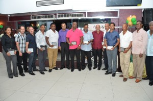 President Ramotar and Natural Resources and Environment Minister Robert Persaud flanked by the awardees and officials within the mining sector