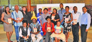 Professor David Dabydeen (centre) with some of the writers posing with their publications 