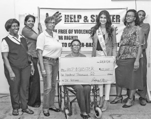 Reigning Miss Guyana World Rafieya Husain (fifth left) with representatives of Help and Shelter 