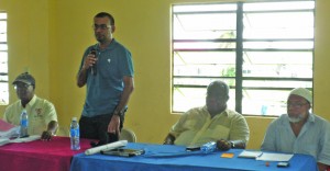 Natural Resources Minister Robert Persaud addressing the gathering at the lottery in Bartica