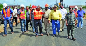 President Donald Ramotar and other Government officials inspecting works on the second lane in Lot Three