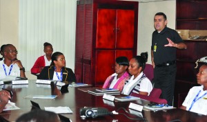 A CBP official conducting training with staff of the CJIA 