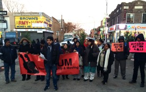 Members of DRUM display placards in support of Obama's immigration announcement