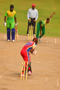 Well played Barney! Umpire Zaheer Mohammed and non-striker Raymon Reifer look on quizzically as Guyana Jaguars skipper Christopher Barnwell gets ready to play this delivery from fast bowler Paul Wintz, during his team’s innings on Wednesday (Photo by Adrian Narine)