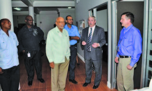 President Donald Ramotar, Natural Resources and Environment Minister Robert Persaud and ExxonMobil’s Country Manager Jeff Simon during a tour of the company’s head office at New Market Street, Georgetown