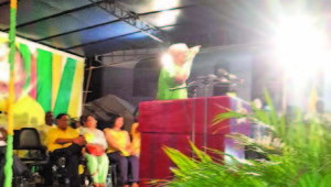 David Granger delivering his speech while Moses Nagamootoo and other executive pay rapt attention   