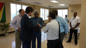 GECOM Chairman, Dr Steve Surujbally (centre) in discussion with diplomats and others at Wednesday’s signing of the code of conduct at Gecom’s Command Centre.