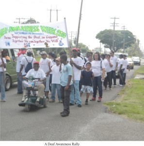 Walcott in his mobilised wheelchair leading the group for Deaf Awareness Week 2010