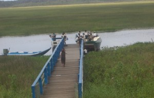 Children disembarking at  Akawini Landing on their way to Akawini Primary School