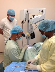 Public Health Minister,  Dr George Norton at GPHC’s Eye Theatre, observing as Dr Ronnie Bhola conducts a surgery