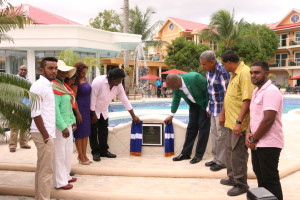 The unveiling of the plaque to mark the official opening of the resort. (From left to right: Alvin Baboolall, Junior Social Protection Minister Simona Broomes, Tourism Minister Cathy Hughes, Mrs Baboolall, Mr Baboolall, State Minister Joseph Harmon, Regional Chairman Gordon Bradford, GTA Director Indranauth Haralsingh and Kevin Baboolall