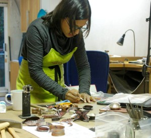 Vannetta teaching fold forming, a process to create sculptural forms in jewllery making, to students