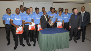 The Honourable Stephen Lashley, Sports Minister for Barbados presented Shimron Hetmyer, Captain of the West Indies U-19 team with a trophy following the team’s victory in the 2016 ICC U19 World Cup Finals. Also in the photo are Conor Looney, CEO for Digicel Barbados, (inside far right) and Michael Muirhead, CEO of the West Indies Cricket Board (far right). 