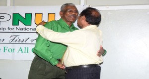 AFC Vice Chairman Moses Nagamootoo and APNU Chairman David Granger share a light moment after signing the Cummingsburg Accord on February 14, 2015 