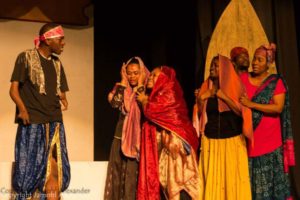 The actor (left) doing what he loves - performing on stage