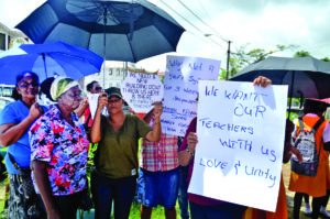 Parents protesting the Education Ministry’s initial plan to close Brickdam Secondary School