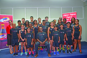 The Champion Squash team along with coach Carl Ince (seated front row) and Digicel’s representative Luana Abrams (far right), and Anjeta Hinds (far  left) of ANSA McAL Trading