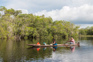 Photo of a couple travelling in a canoe