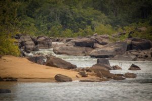 Passing ancient rocks along the Kurupukari River crossing (Photo courtesy Girendra Persaud, Gxmedia)