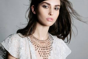 A model presents a bib necklace piece similar to one worn in an episode of TV show “Reign”