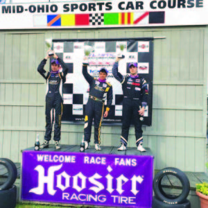 Calvin Ming (centre) celebrates yet another podium finish  