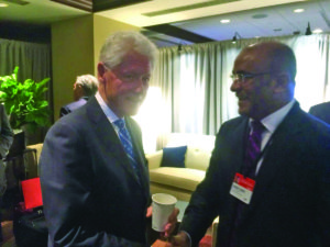 Opposition Leader Bharrat Jagdeo shares a light moment with former US President Bill Clinton on the sidelines of the 12th Clinton Global Initiative’s Annual Meeting