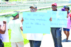 PPP General Secretary Clement Rohee protesting in front of the High Court for the election petition to be expedited 