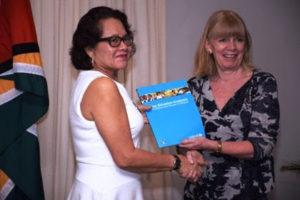 UNICEF Representative in Guyana, Ambassador Marianne Flach presenting the report to First Lady, Sandra Granger 