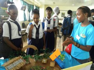 A member (right) educating students on conservation of the environment