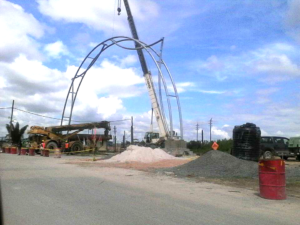 Workers erecting the Centennial Arch at the construction site on Tuesday 