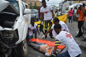 Actors of the Artiste in Direct Support group participate in a simulation exercise at the launch of Road Safety Week in Georgetown. 