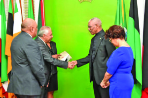 President David Granger exchanges a handshake with the newlyaccredited Ambassador Jose Kinn Franco after the ceremony at State House on Wednesday 