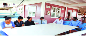 From left to right: Lisa and Rayon Clifford, the dead man’s children, along with his wife, Mohani Devi Clifford with GPL Chief Executive Officer Renford Homer; Divisional Director (Human Resources) Bal Parsaud and GPL Deputy Chief Executive Officer (Technical) Elwyn Marshall